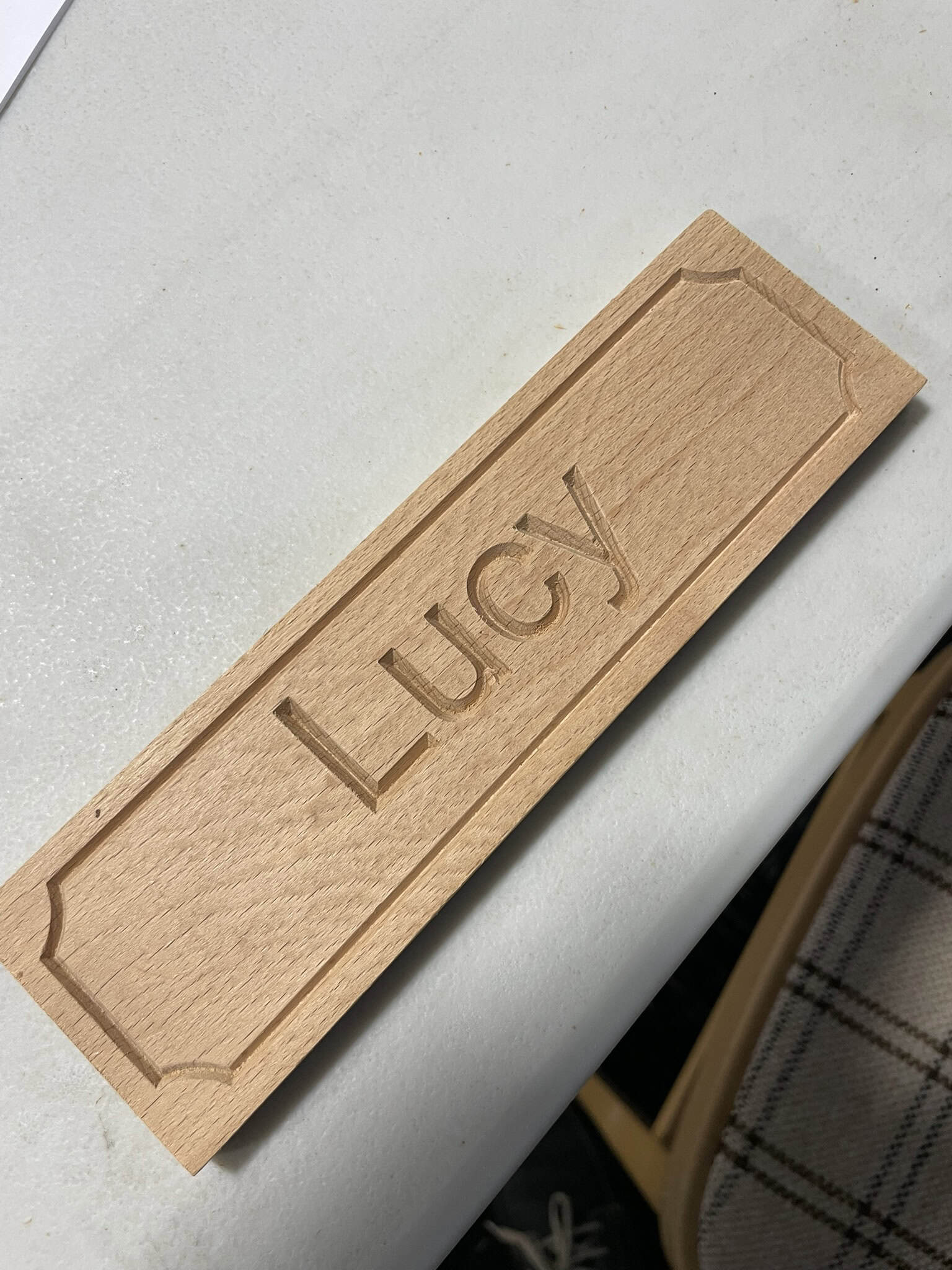 Childs Bedroom plaque showing the name Lucy Vcarved in it at the Belford arts festival